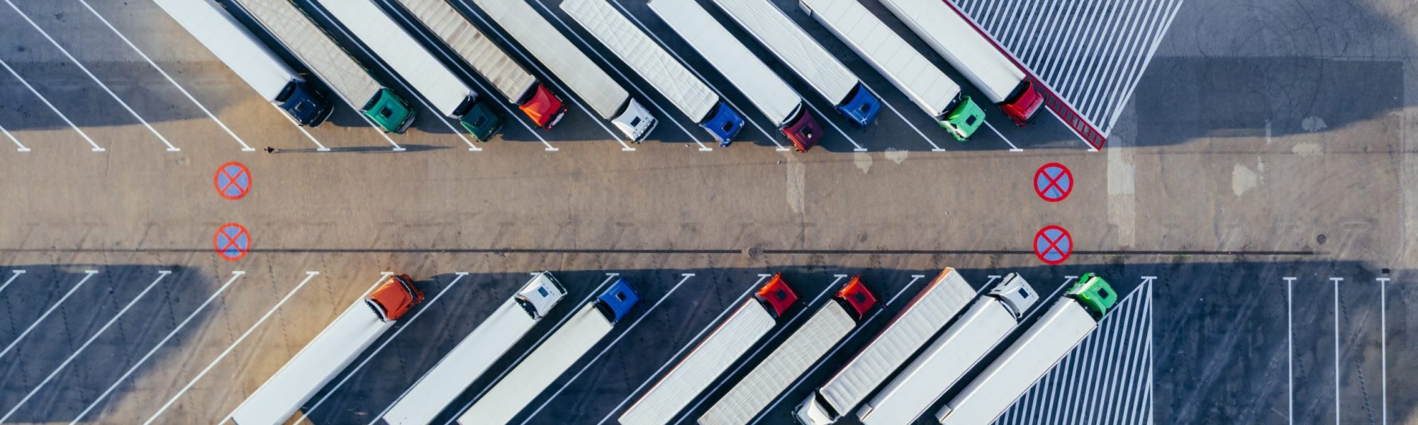 aerial-photography-of-trucks-parked-2800121